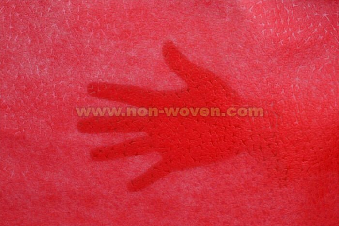 Red wrapping paper nonwoven